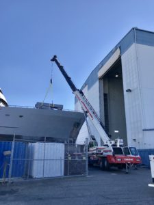 Crofton Crane Rental & Rigging's 90-ton Link-Belt placing a crane boom back on the ship